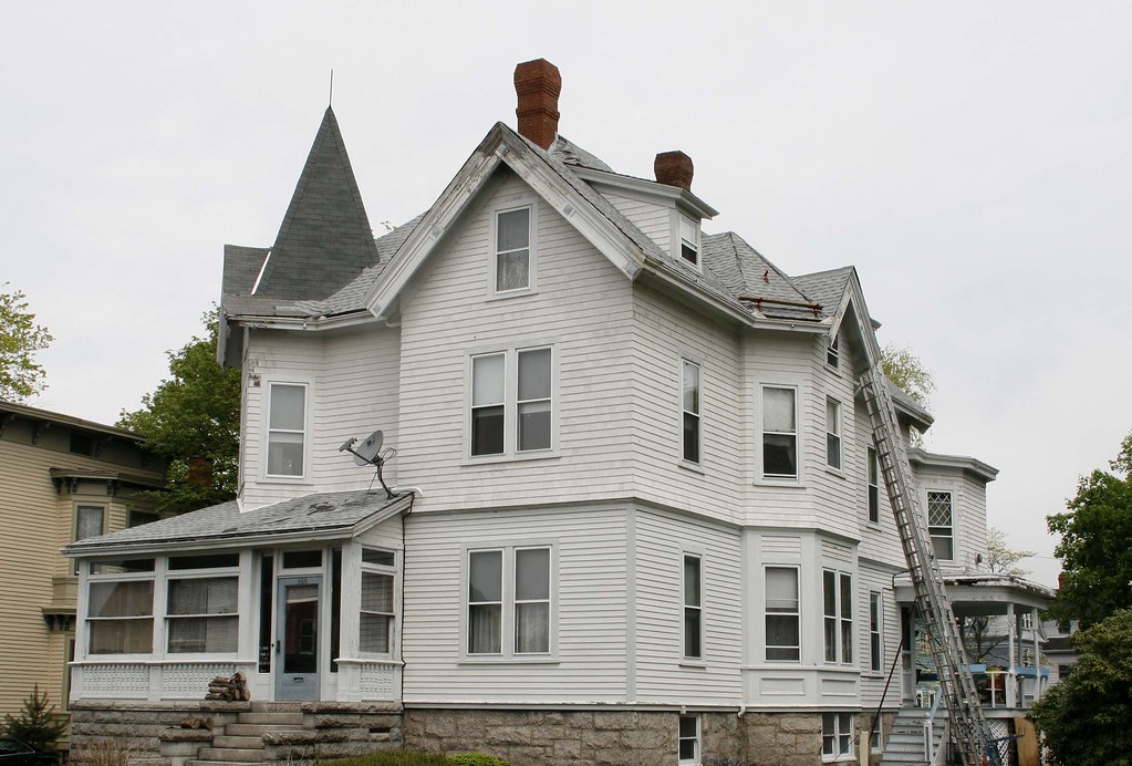 The maplecroft mansion is pictured, it’s a large white home with sharp peaks and lots of windows